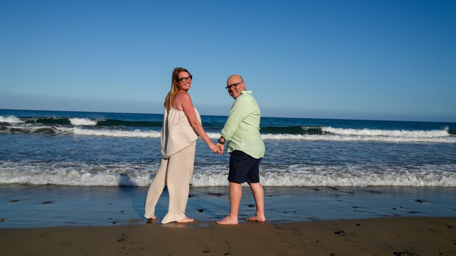 Couple on beach at sunset