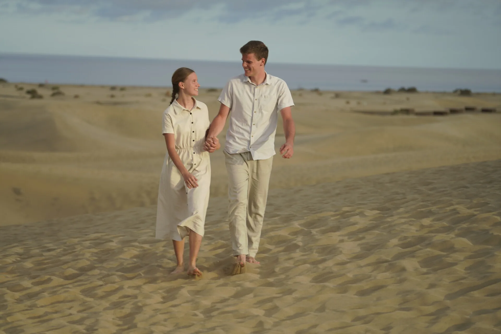 Couple hand-in-hand Maspalomas Dunes