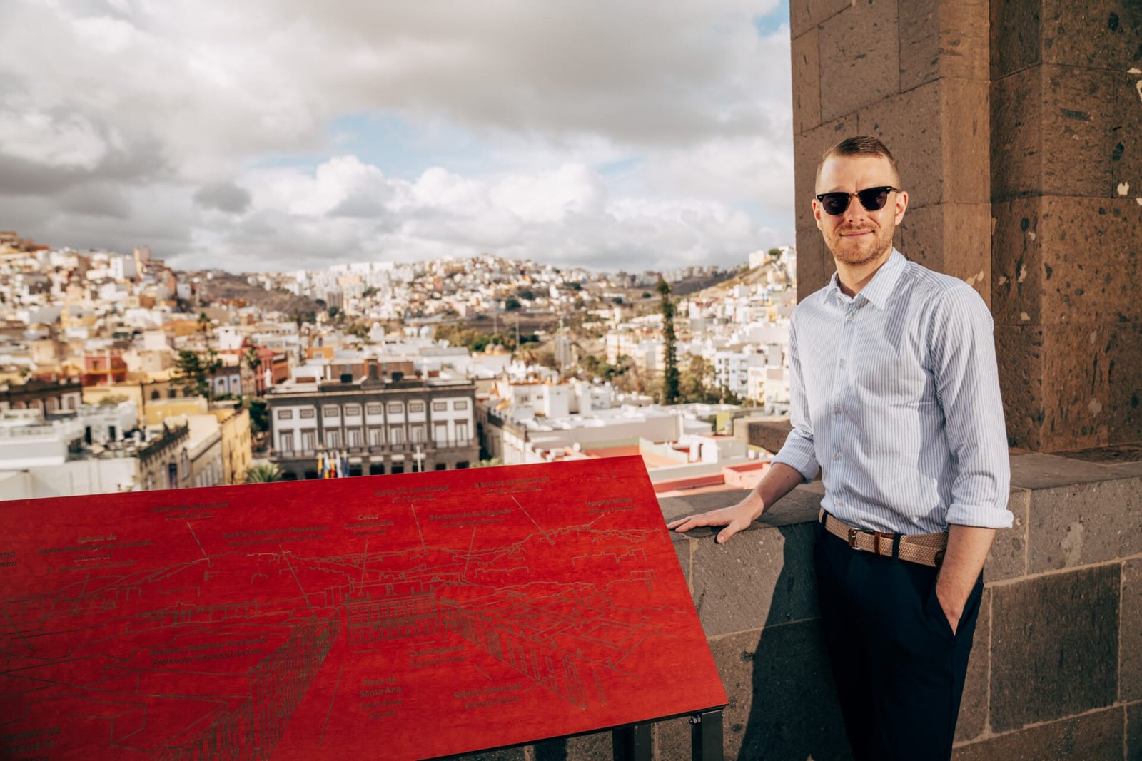 Man portrait viewpoint Las Palmas cityscape red map panel Gran Canaria