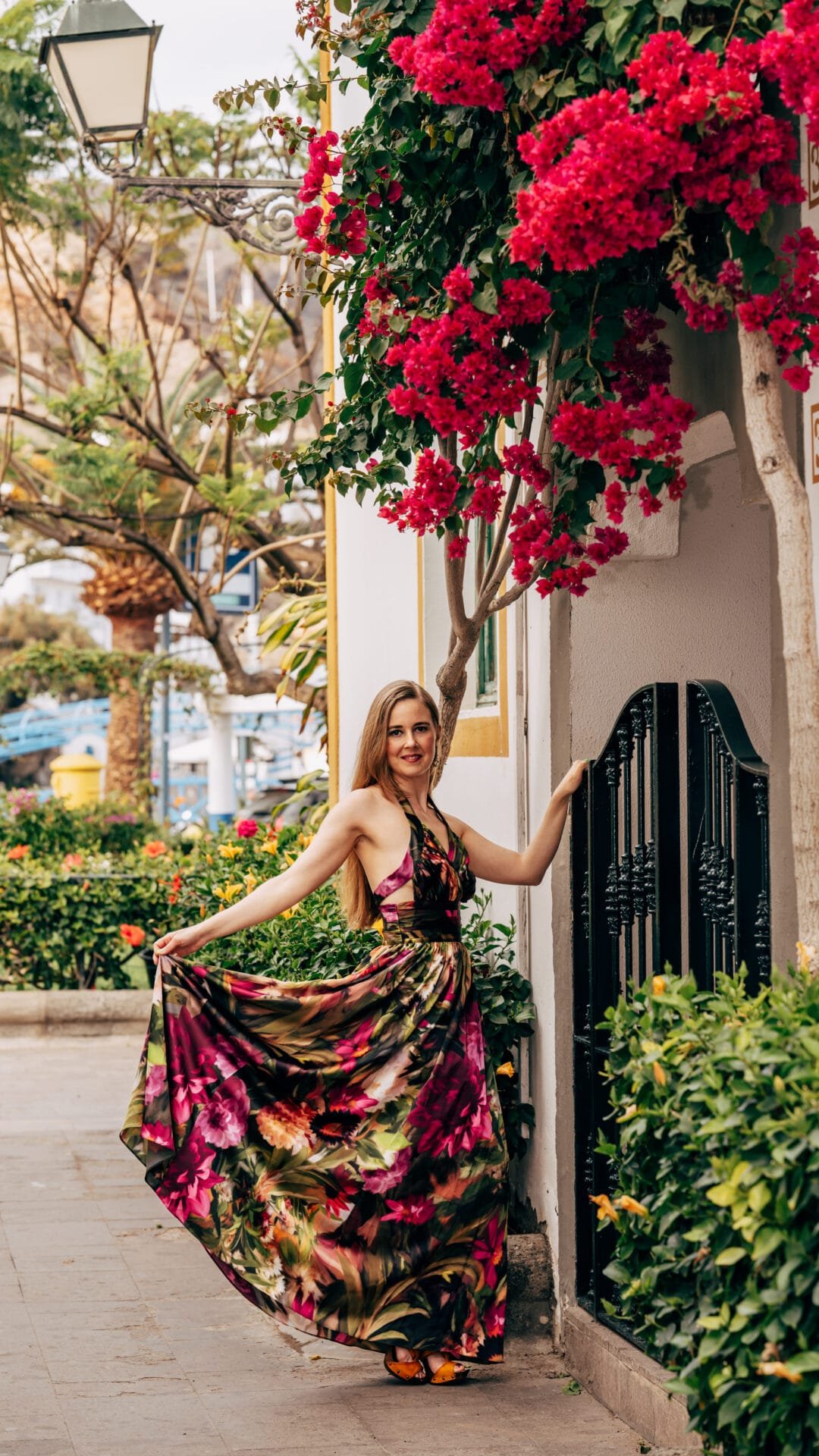 Woman in floral dress with bougainvillea Gran Canaria
