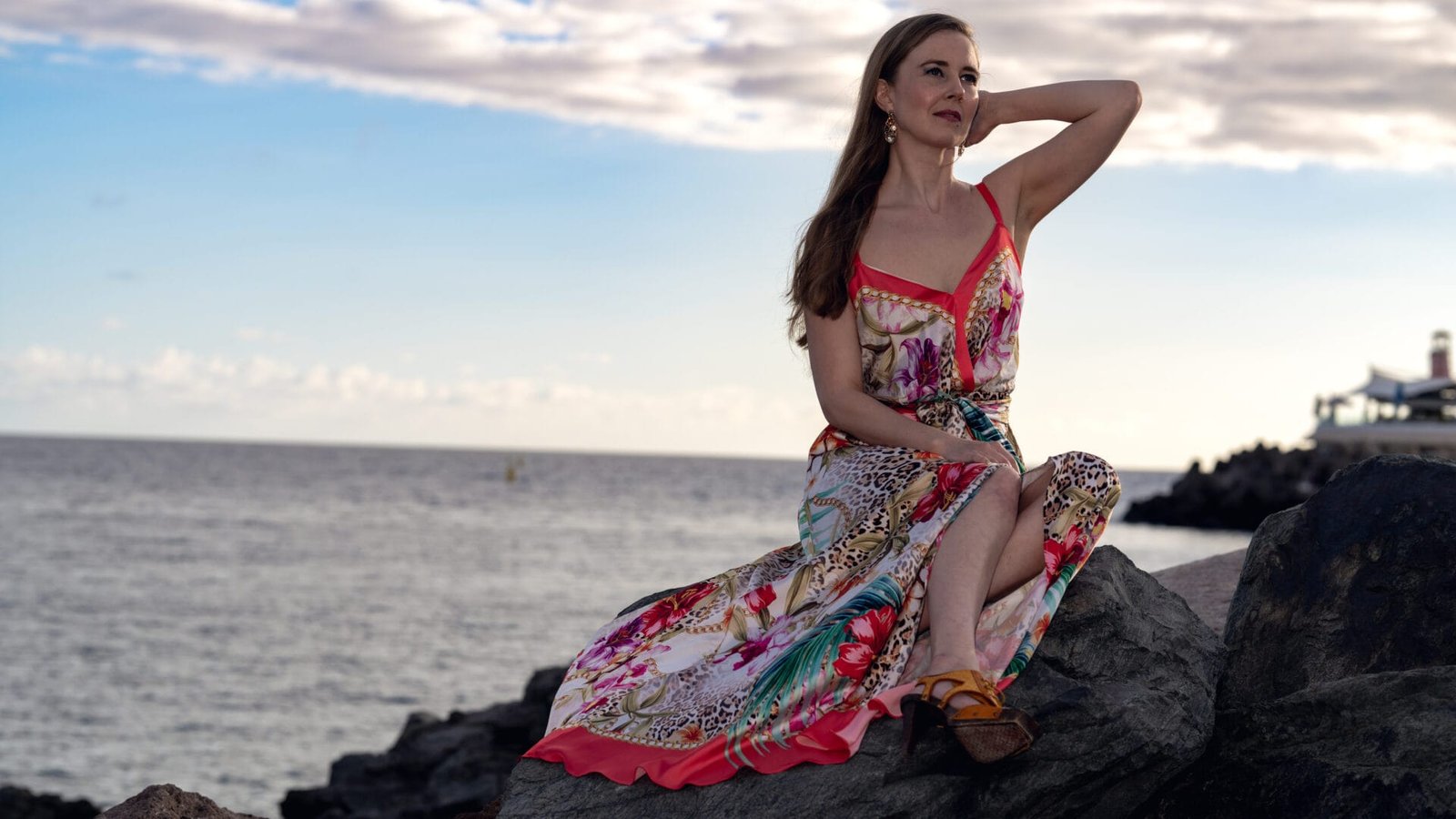 Fashion portrait photoshoot Puerto de Mogán coastline lighthouse dusk Gran Canaria