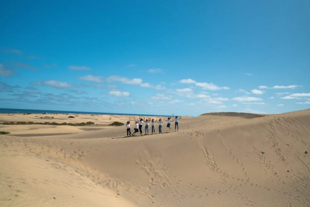 Friends having fun during a photoshoot at maspalomas