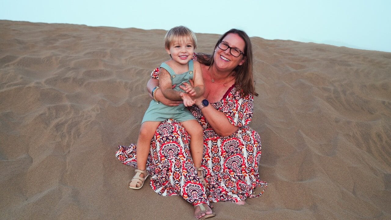 Mother and child on dunes