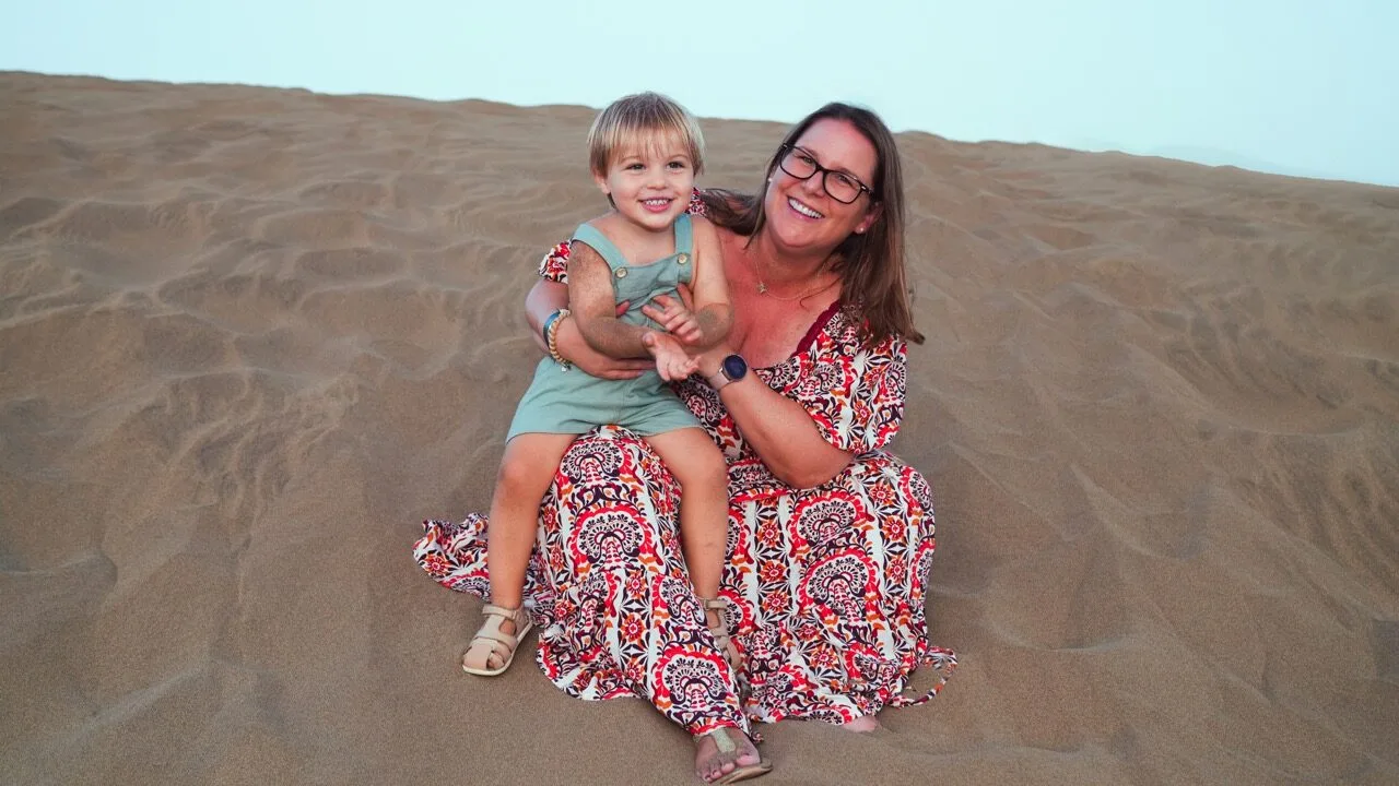 Mother and child on dunes