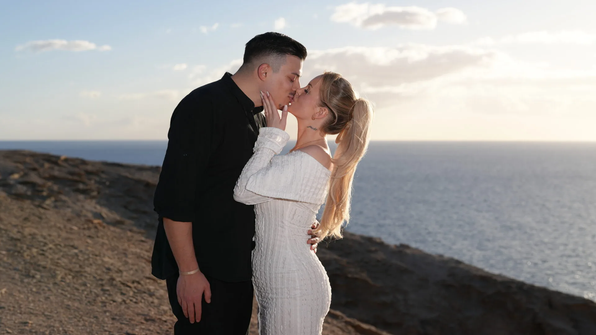 Couple kiss on cliff