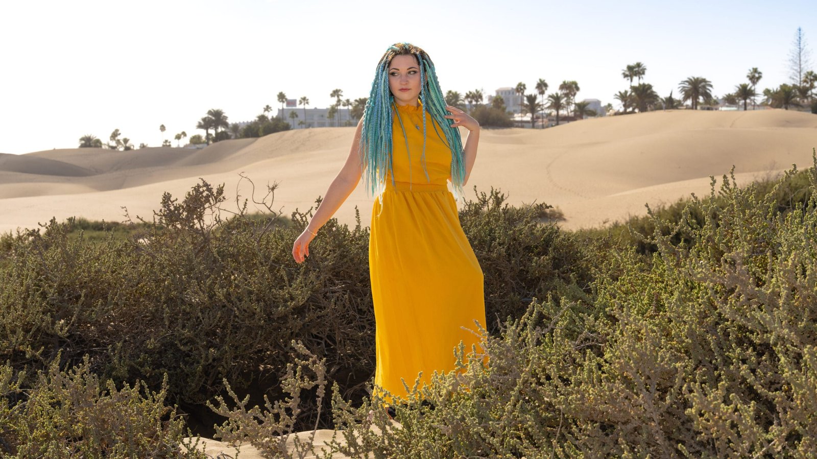 Woman in yellow dress at the dunes Gran Canaria