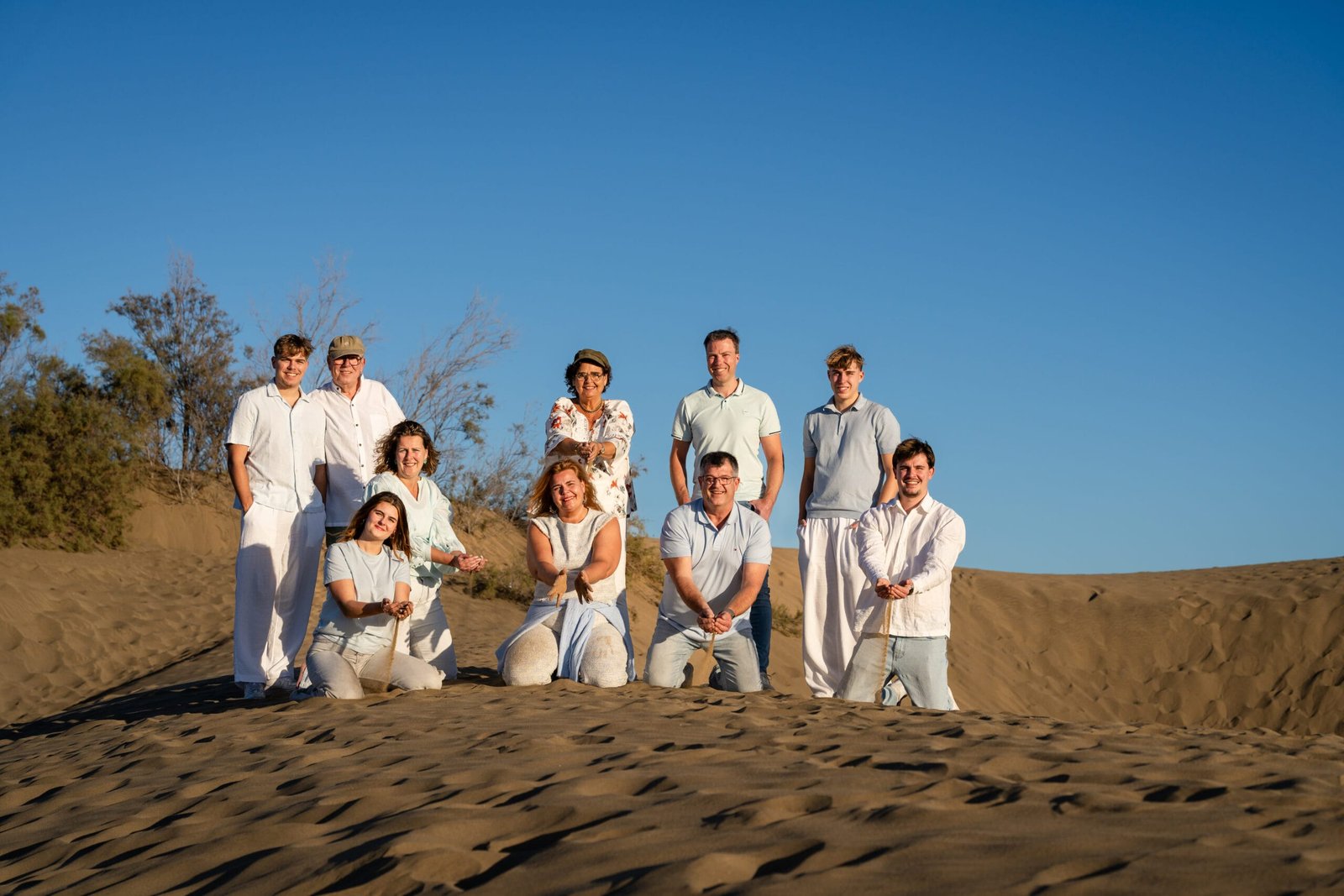 Large family group in white on Maspalomas Dunes