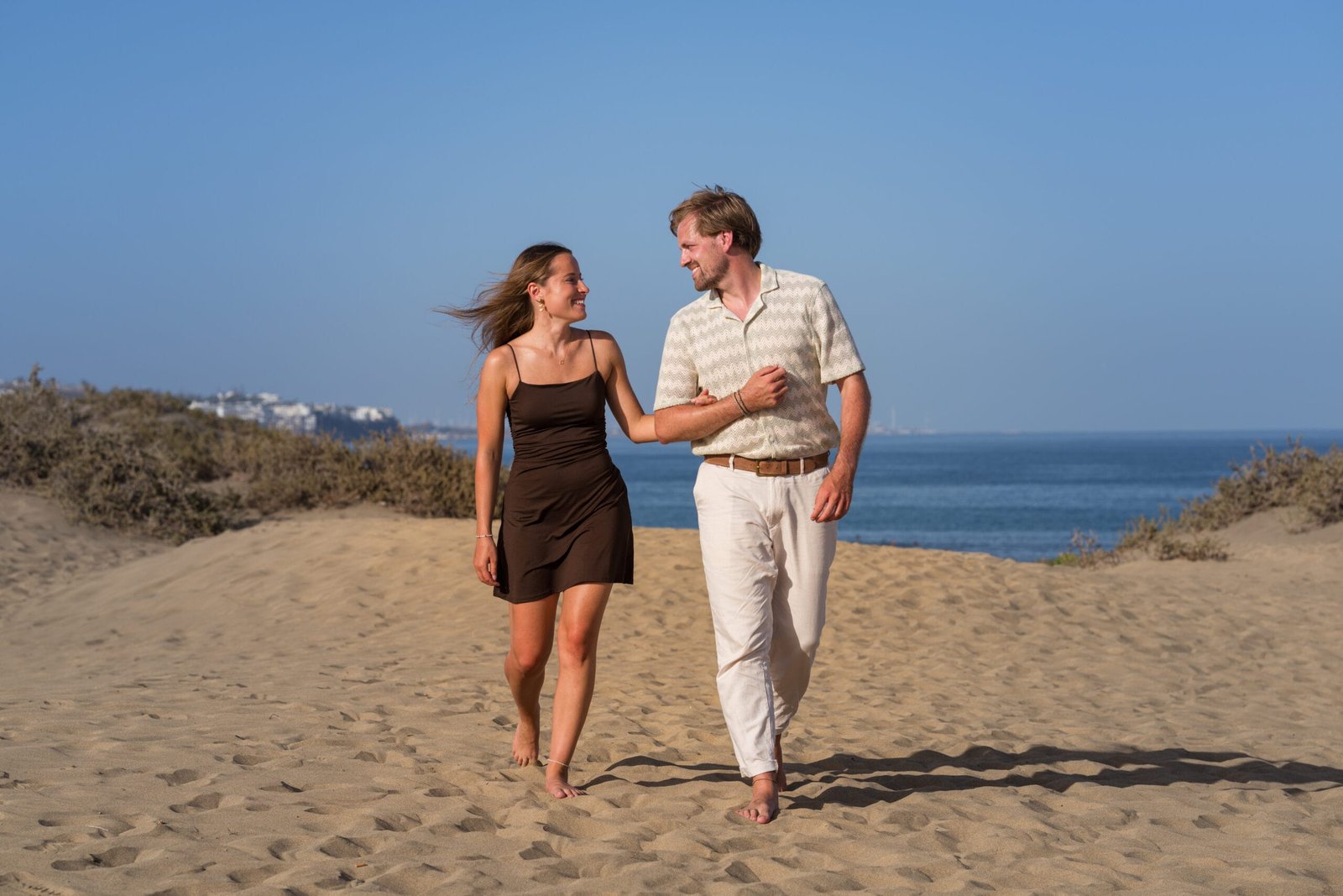 Couple strolling Gran Canaria beach