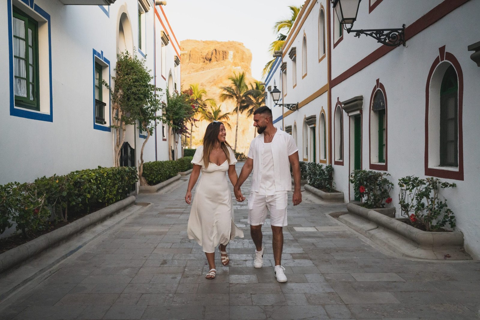 Couple photoshoot cobbled street Puerto de Mogán Gran Canaria mountain backdrop