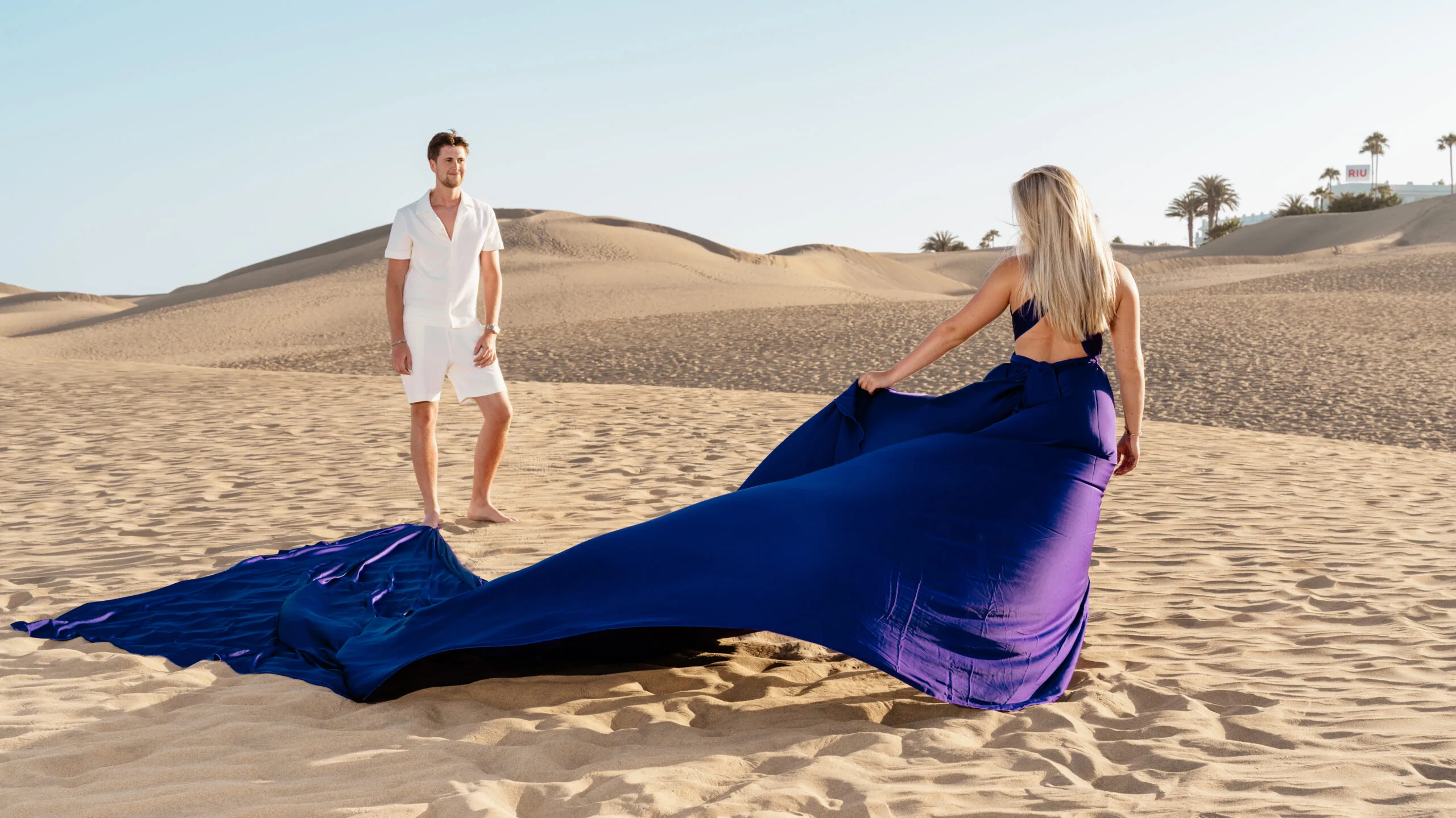 Flying dress experience for couple royal blue gown on Maspalomas dunes