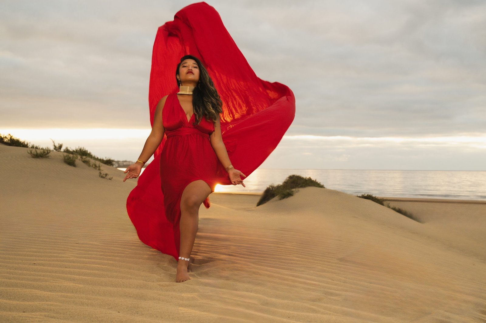 Ethereal flying dress in crimson red golden hour Gran Canaria