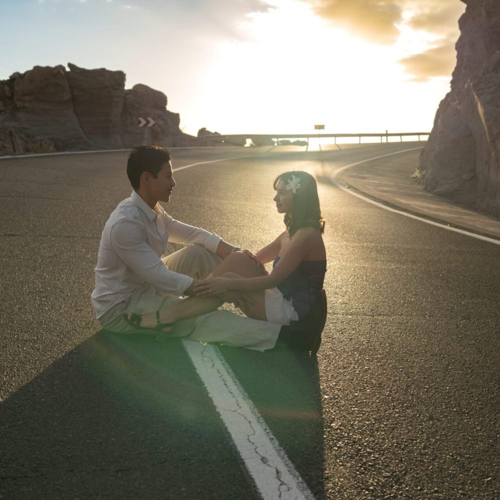 Love story cinematic couple photoshoot on a road